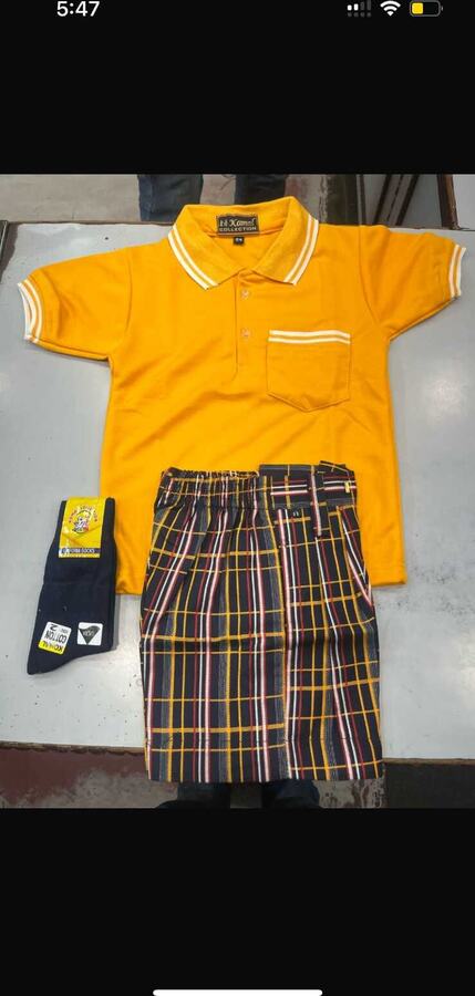 Yellow polo T shirt with checked shorts and socks