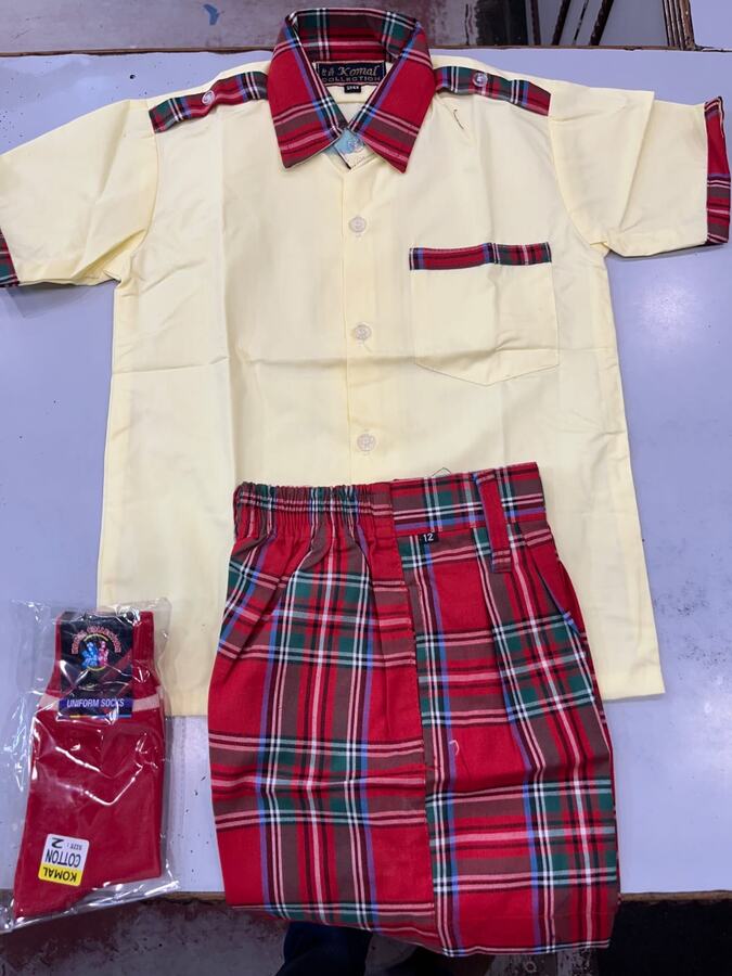 Cream shirt with red checked shorts and socks