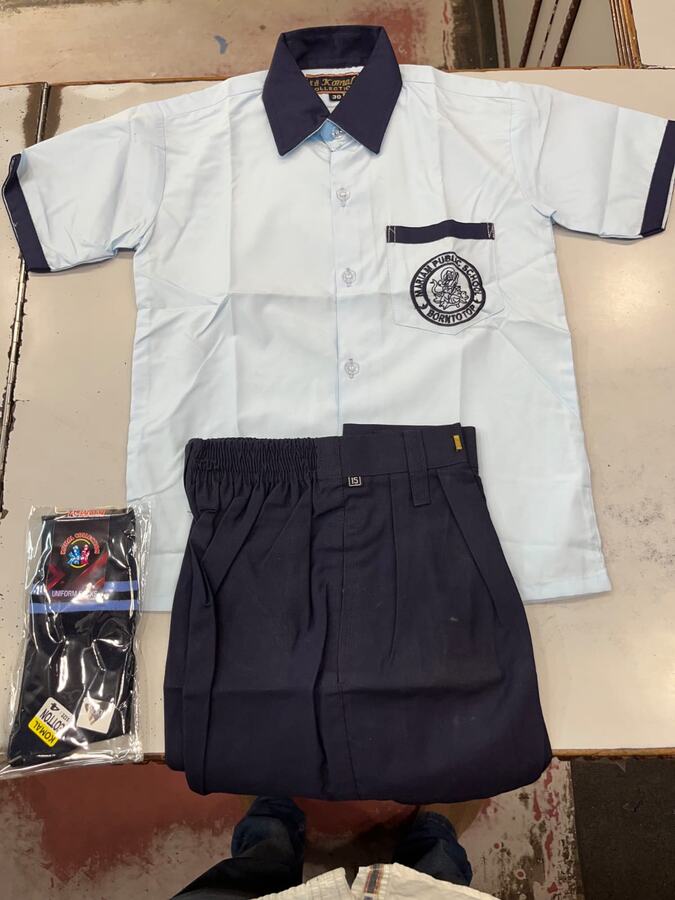 White shirt with navy collar, monogram and navy shorts