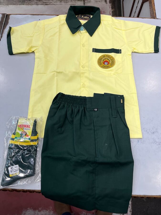 Yellow shirt with green collar, monogram and green shorts